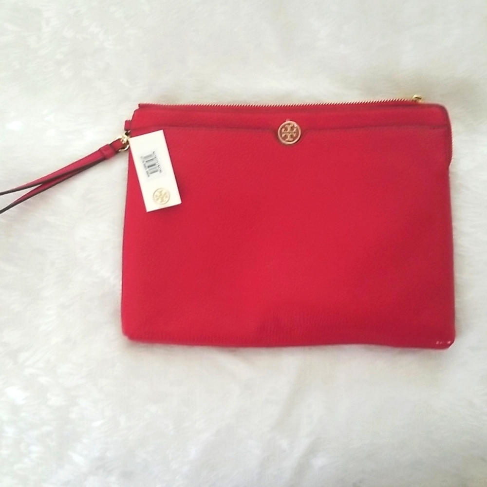 Brand new Tory Burch clutch zipper and pocket. Purchased at Nordstrom Kir Royale